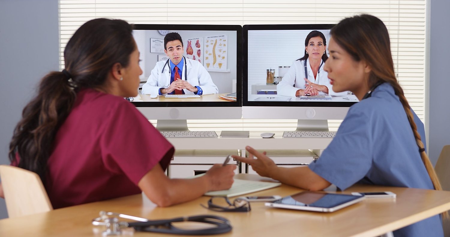 Clinical staff on a video consultation with two physicians